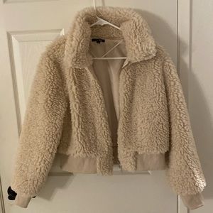 Faux fur bomber jacket . Beige super cute. Light lining.Nw/o tags